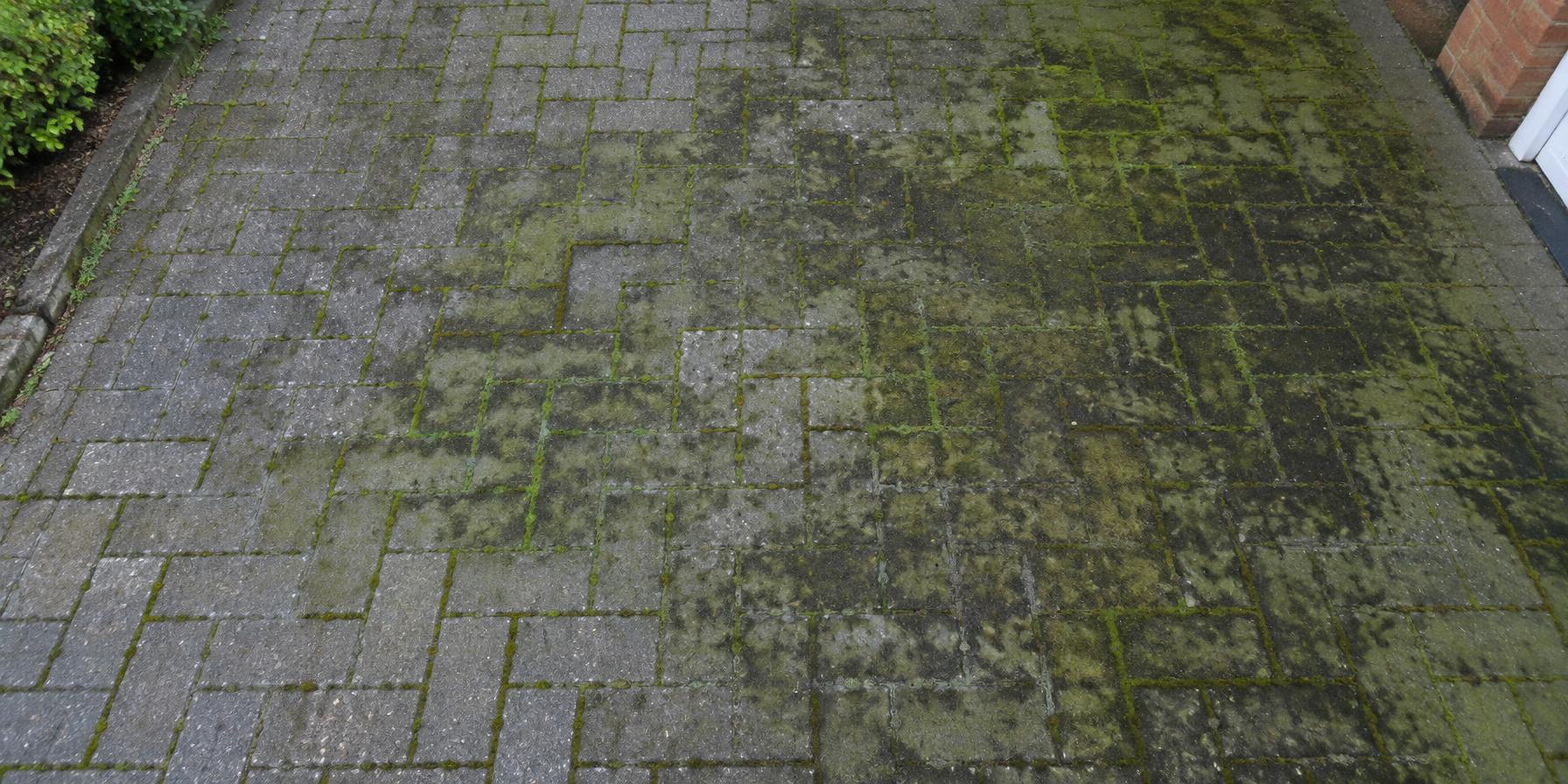 Block paved drive green with algae before cleaning